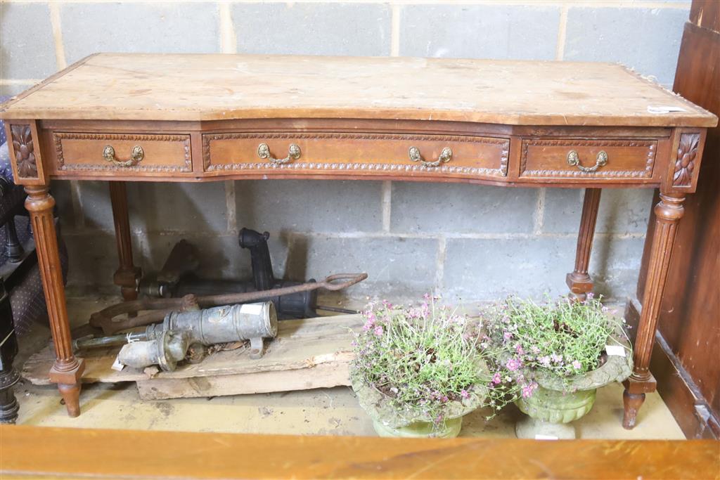 A French walnut dressing table, width 143cm, depth 59cm, height 79cm (a.f.)